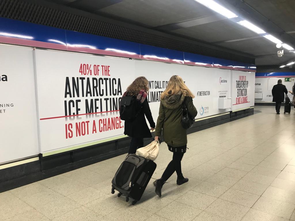 Participants of the UNFCCC-COP25 meeting in Madrid, passing by the station's e.xit near the meeting location