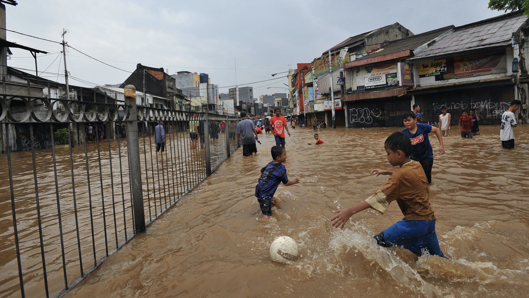 Children playing during the flood in Jakarta some time ago.