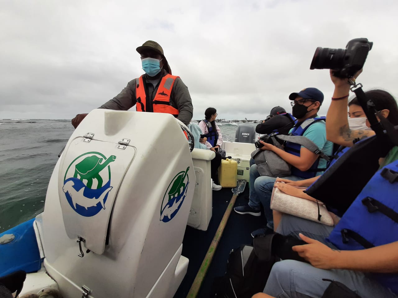journalists on a speedboat in the Galapagos