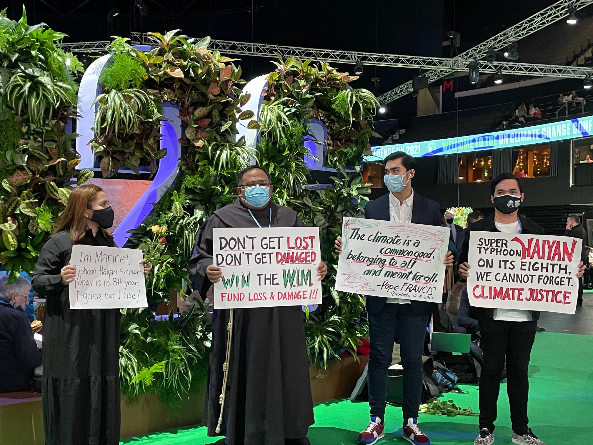 Activists press their call for “climate justice” as they commemorate the tragedy wrought by the 2013 Supertyphoon “Haiyan”—the mass killer known to Filipinos as “Yolanda”—inside the venue of COP26 in Glasgow, Scotland. —IMELDA V. ABAÑO