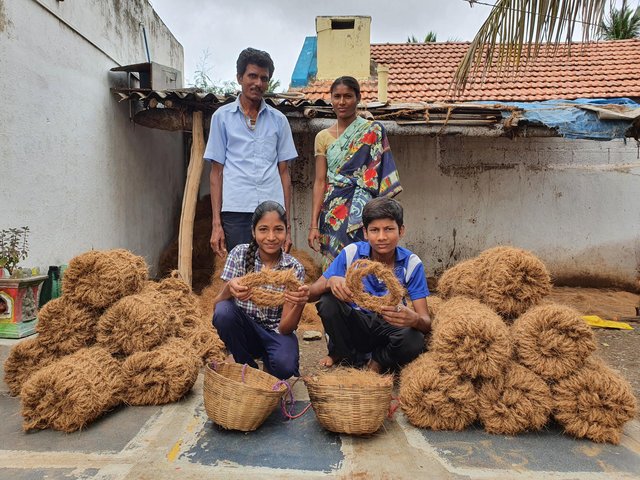 a family outside with coir rope