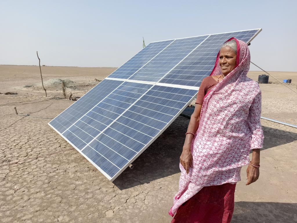 Kanuben, a salt worker, with her solar panel. Photo: Ravleen Kaur