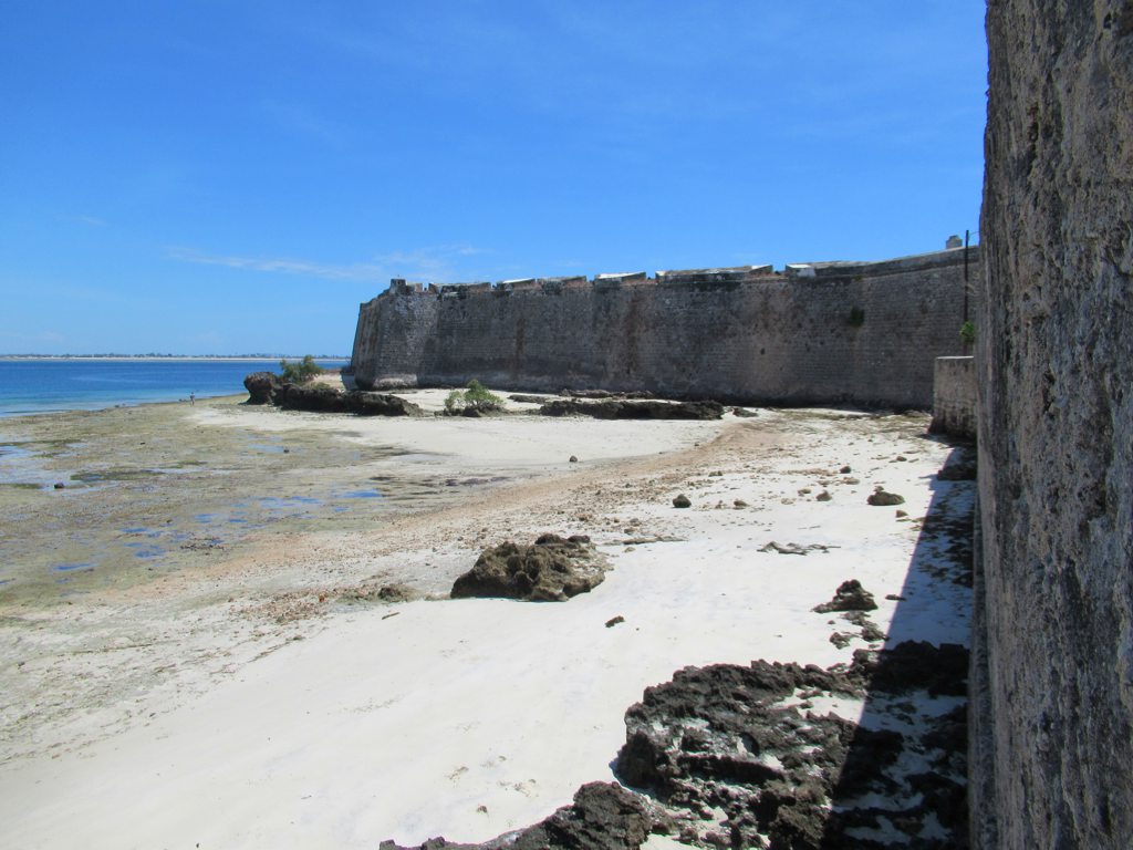 a beach with fort walls 