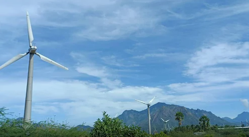 windmill against mountain backdrop