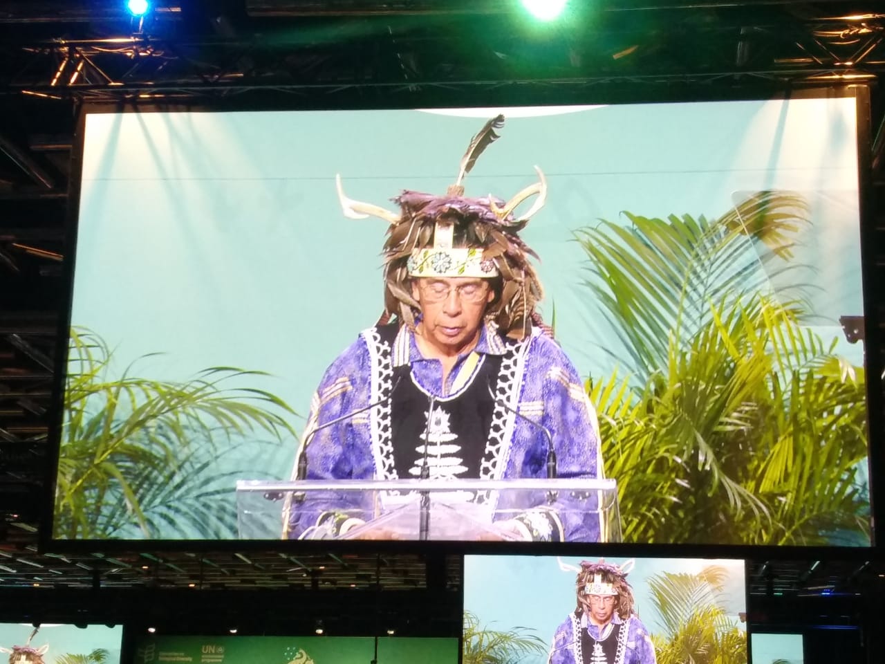 an Indigenous person on a large screen