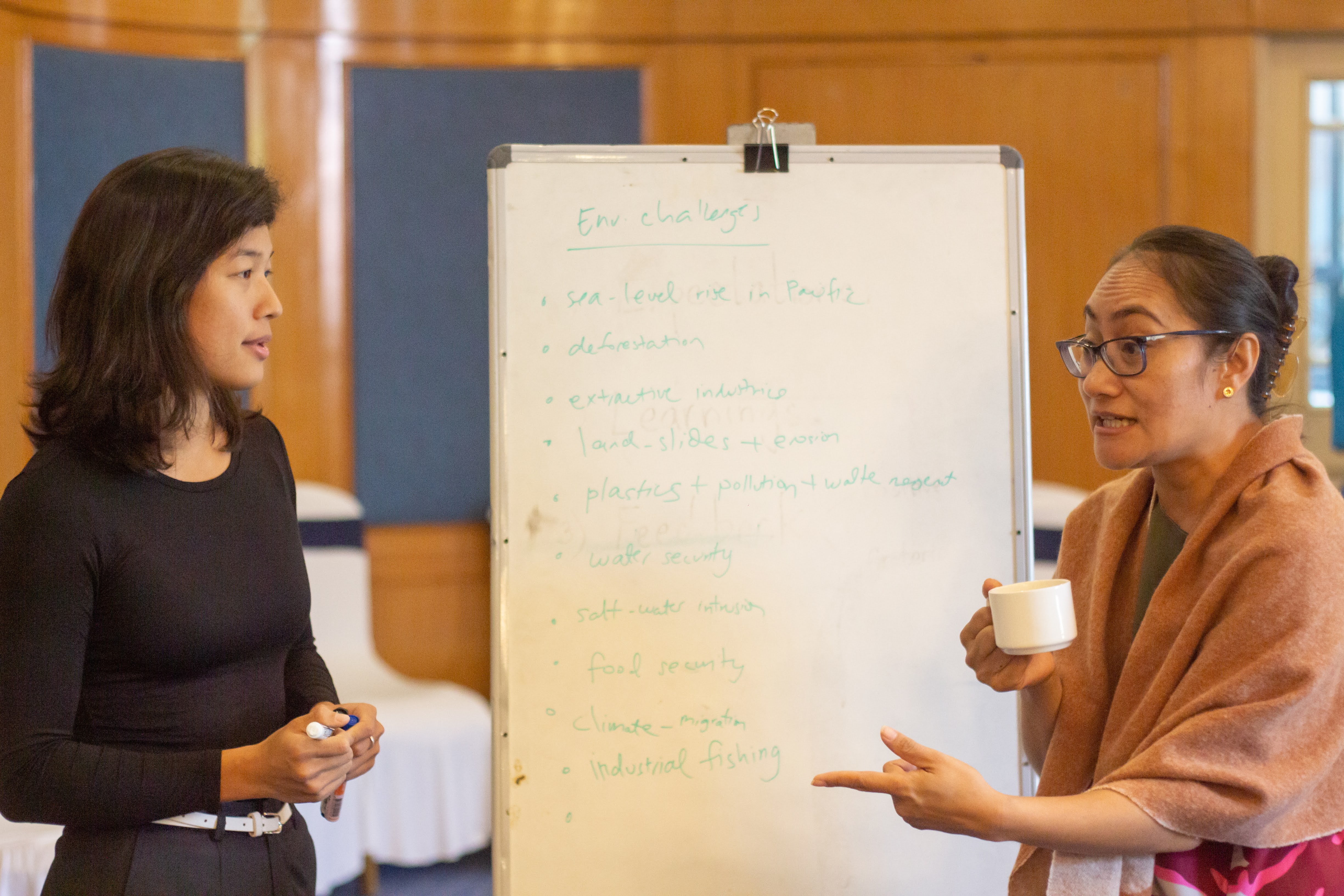 Participant from Thibi, Myanmar, Thwe Thwe Soe (Nida) (left) and EJN’s project coordinator for Asia, Donna Hoerder (right) from Fiji, discussing key environmental challenges of Asia-Pacific countries / Credit: Michael Salzwedel. 