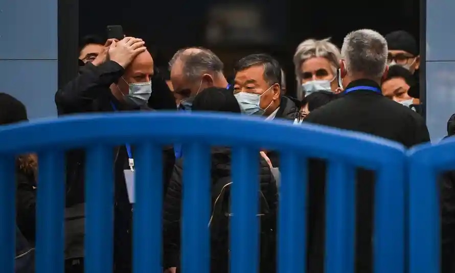 Members of the WHO team investigating the origins of the coronavirus visit the Huanan market in Wuhan in January 2021. Photograph: Héctor Retamal/AFP/Getty