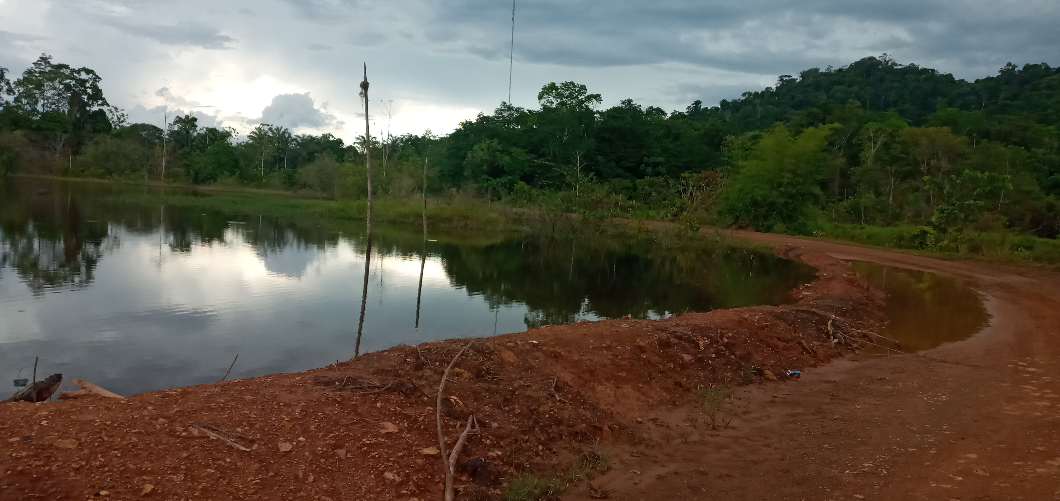 A water body with the land around it disturbed as a result of mining operations