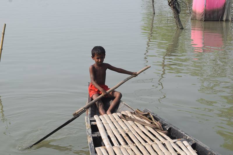 A boy in a makeshift boat