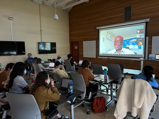 berkeley students in class viewing a lecturer on screen