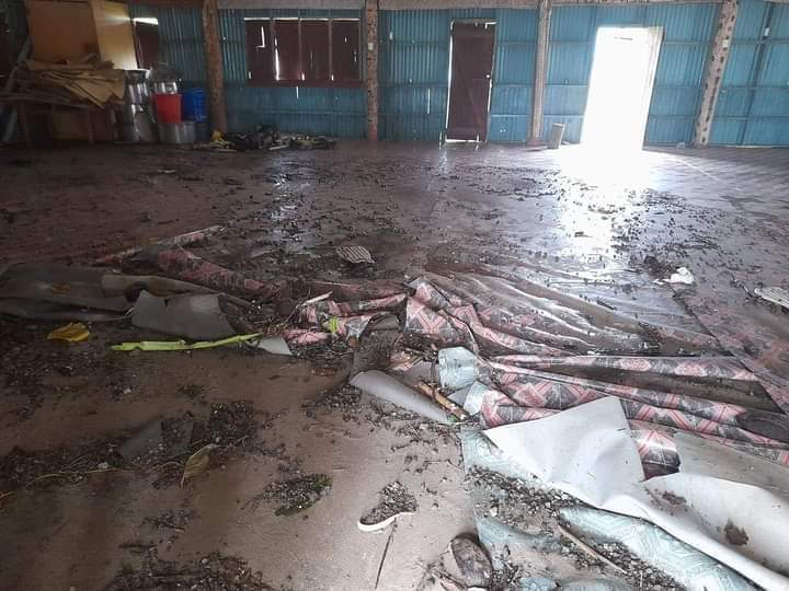 The floor of a building covered in debris