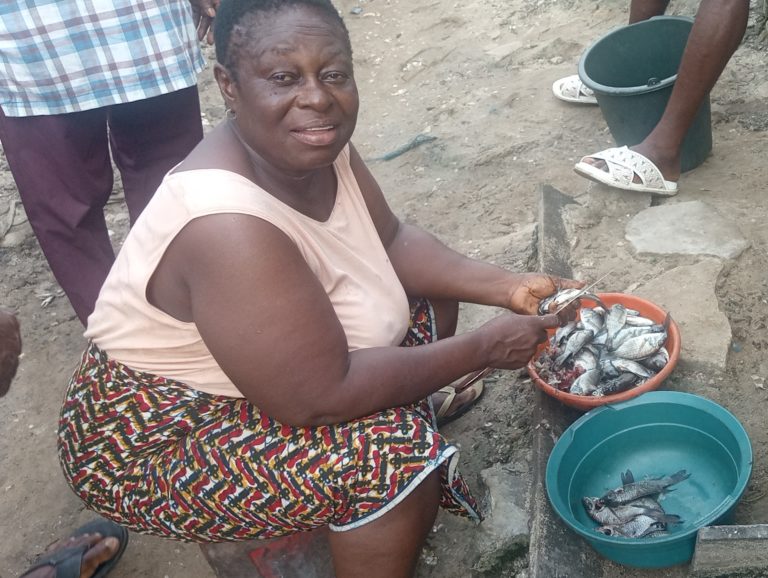 Helen Oputubeya only got a few fish after several hours in the river. Photo credit: Elfredah Kevin-Alerechi