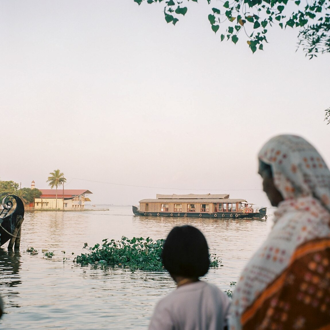 Visitors take in the view of Lake Vembanad from the city of Alleppey in India’s Kerala state. The lake is a popular vacation spot for Indians and visitors from other countries.