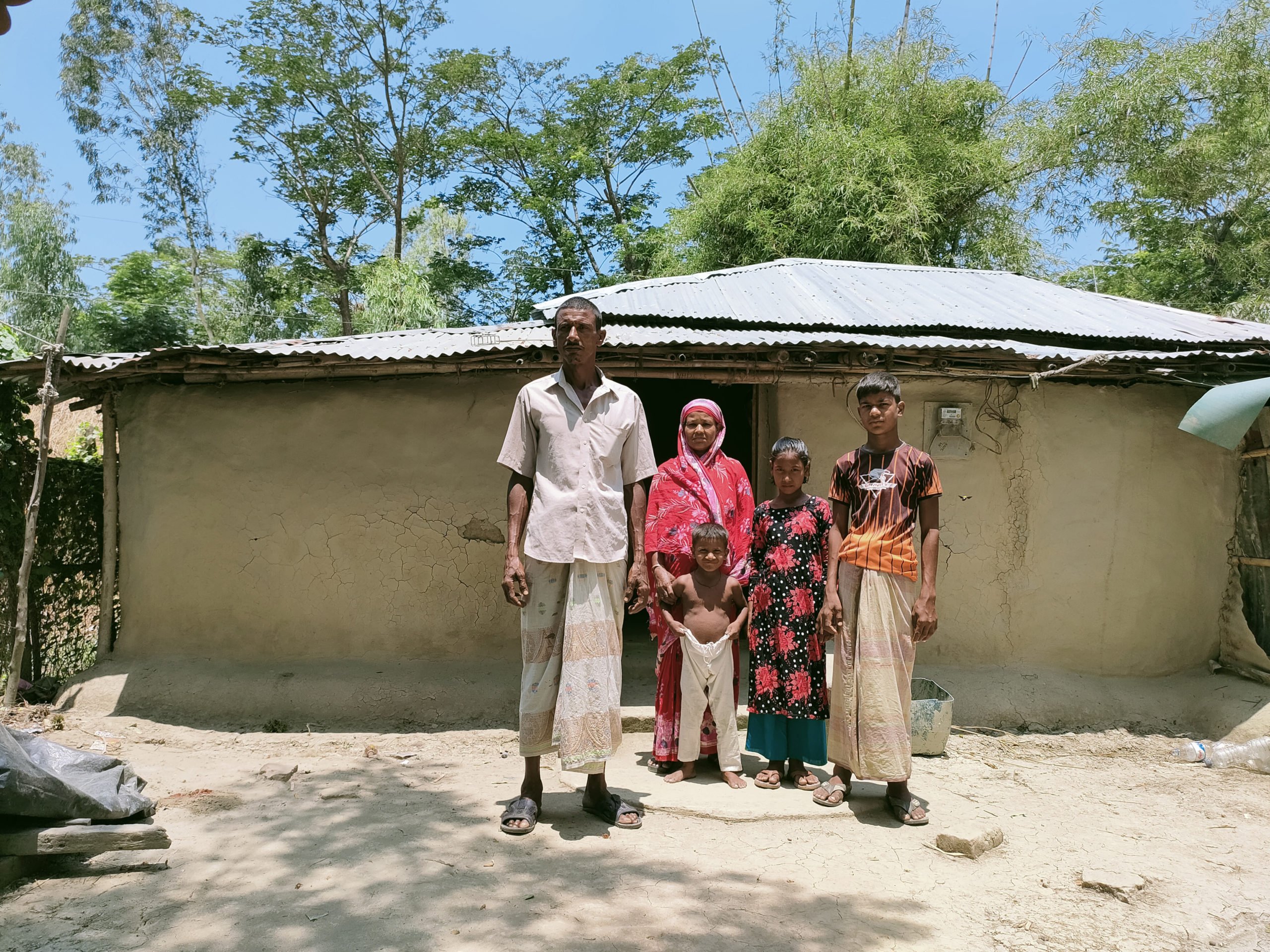Nurul Kabir and his family. Kabir says he did not sell his land to the power plant authorities, and that it has been sold fraudulently. (Image: Shamsuddin Illius)
