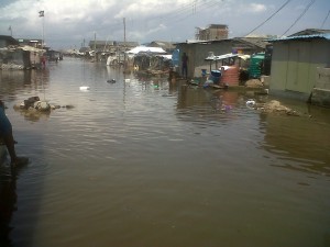 A flooded street at the Okun Alfa community