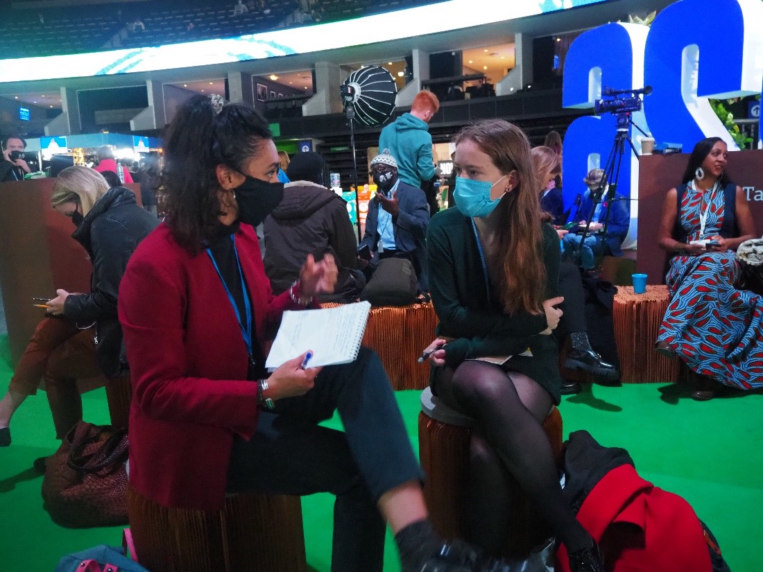 COP26 Fellow Aida Delpuech interviewing a source in Glasgow, 2021 / Credit: Charlie Debenham.
