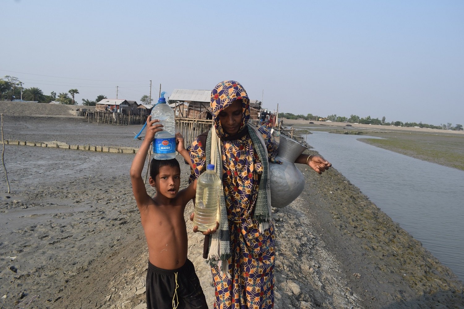 Woman and child collecting water