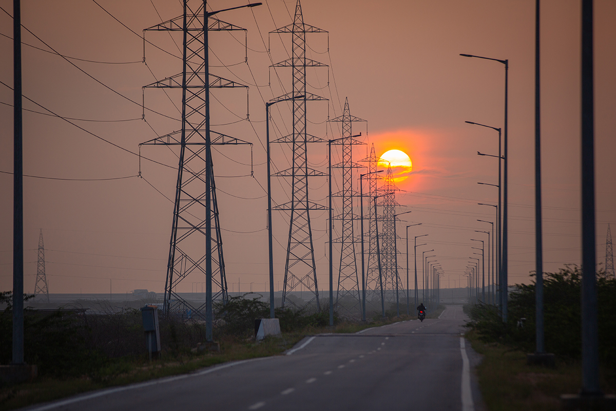 Electricity pylons along a road through the Pavagada Solar Park. Photo by Abhishek N. Chinnappa/Mongabay.