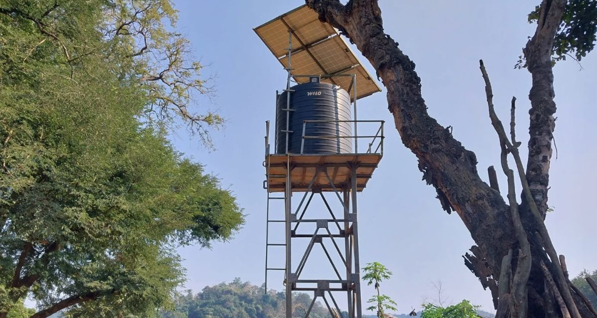 A water tower with solar panels