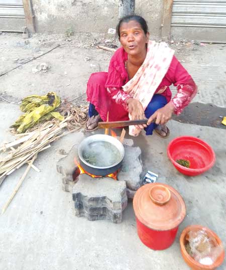 a woman cooking outdoors