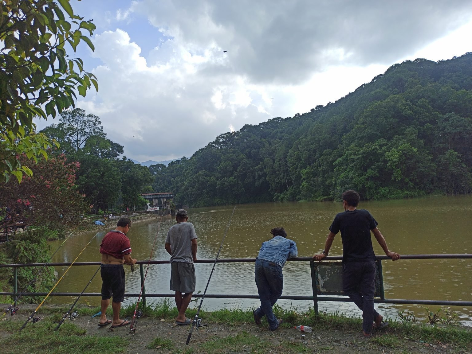 men at a lake fishing