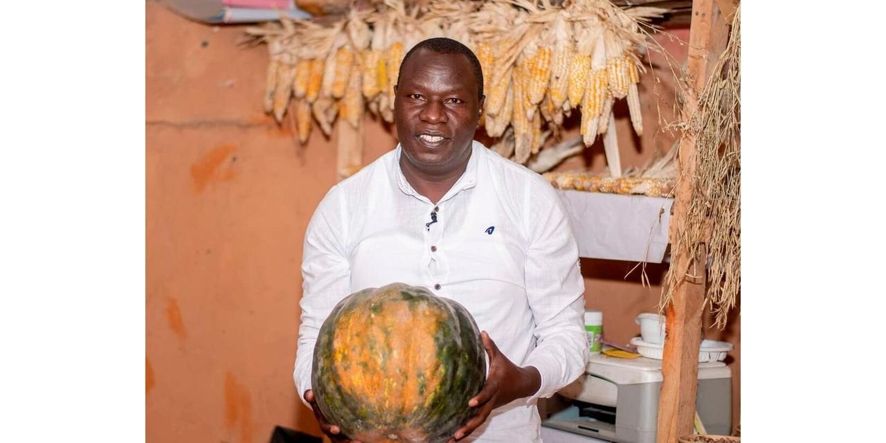 a man holding a gourd