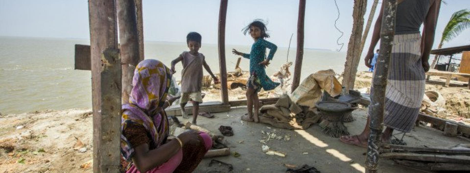 a family that was forced to leave their village due to sea level rise