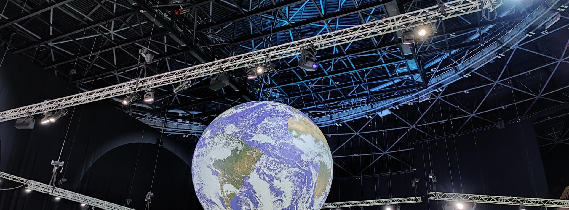 Action zone at the COP26 venue in Glasgow, Scotland where this rotating globe reminds delegates of what they are trying to save (Photo: Disha Shetty)