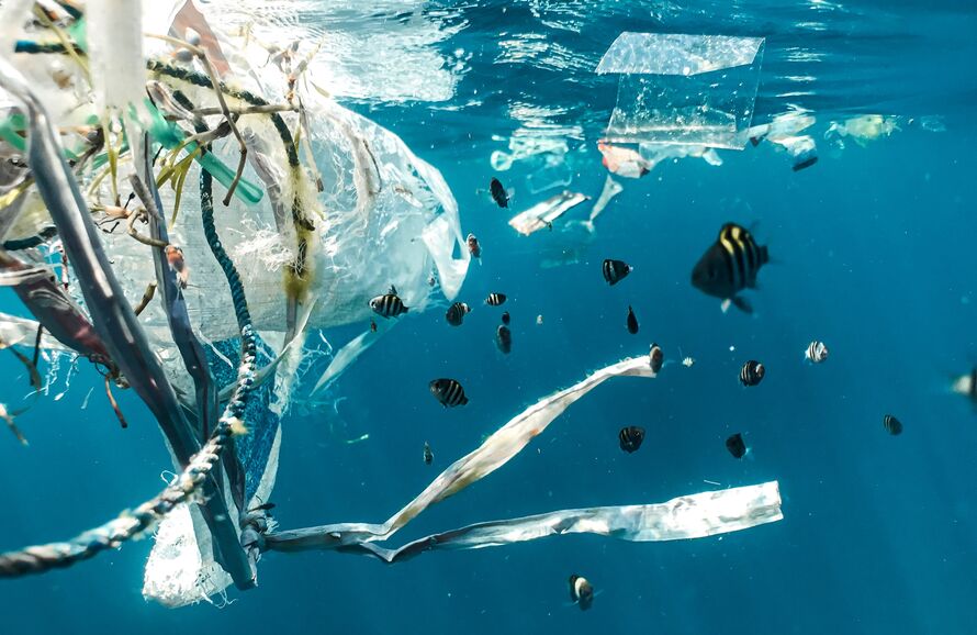 plastic pollution at the surface of the sea viewed from underwater