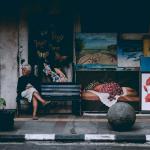 Woman sitting near street art in Bandung