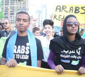 Climate activists march outside UN talks in Qatar 
