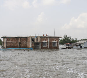 A house half-submerged by floods in West Bengal, India. 