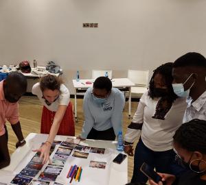 workshop participants study Climate Fresk cards