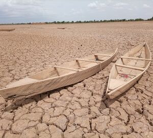 Dried up lake bed and boats