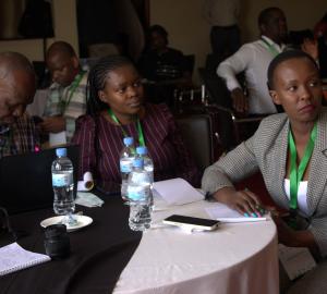 journalists at the Pre-Cop conference seated at a table