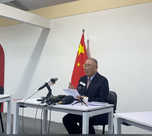 xie zhenhua speaking at a press conference