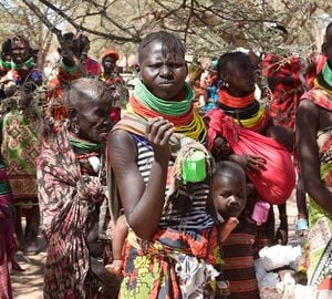 Members of the public wait for their rations of relief food distribution by President William Ruto to hunger victims due to prolonged drought, at Nakaalei in Turkana on November 5, 2022.  Jared Nyataya | Nation Media Group