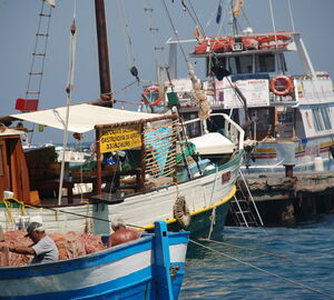 Fishing boats and fishermen in a harbor