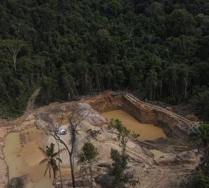 mining pits filled with water in a deforested area 
