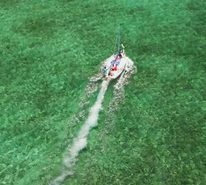 aerial photo of a boat in the water