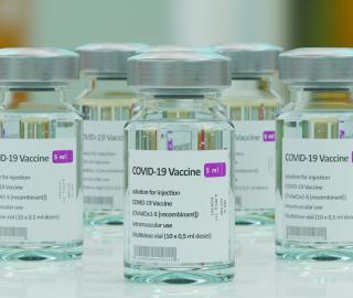 several vials of Covid-19 vaccine sitting on a counter