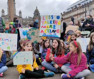 Climate activists, including hundreds of children, protest at George Square in Glasgow, demanding action on climate change from world leaders and politicians at COP26. Photo: Shamsuddin Illius