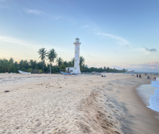Oluvil Port Lighthouse on the beach, Sri Lanka
