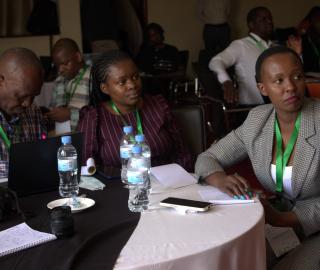 journalists at the Pre-Cop conference seated at a table
