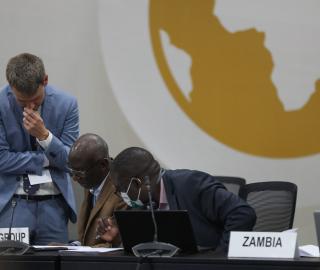 negotiators in the african group sit in their chairs
