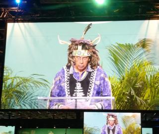 an Indigenous person on a large screen