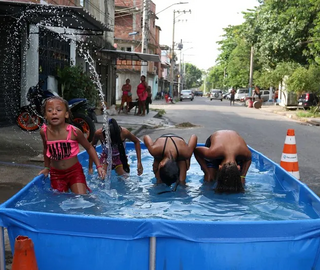 kids in a pool on the street