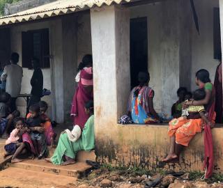 Mothers wait outside a clinic in Odisha