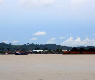 Barges transport coal on the Mahakam river in East Kalimantan, Indonesia