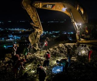 Informal miners search for jade